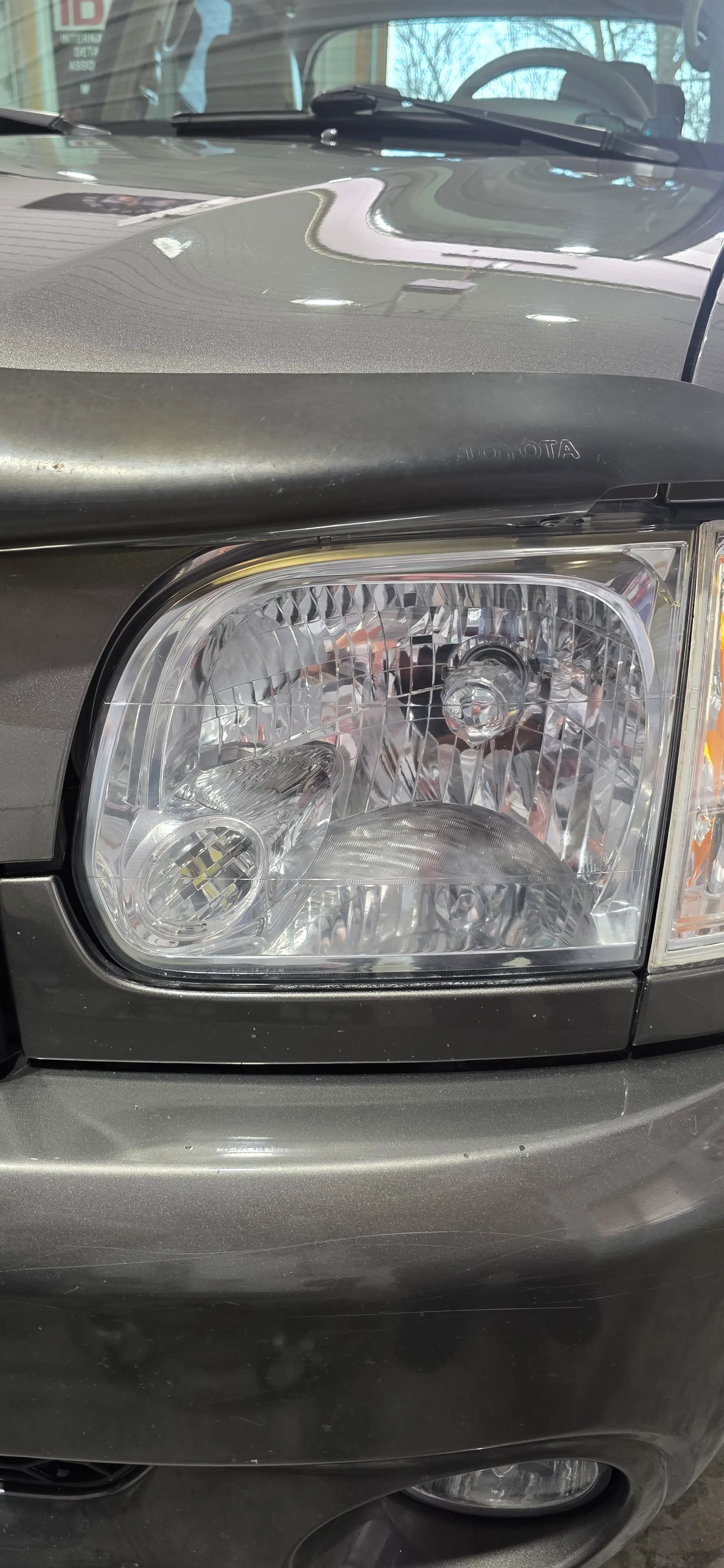 Clear restored headlight after professional headlight restoration