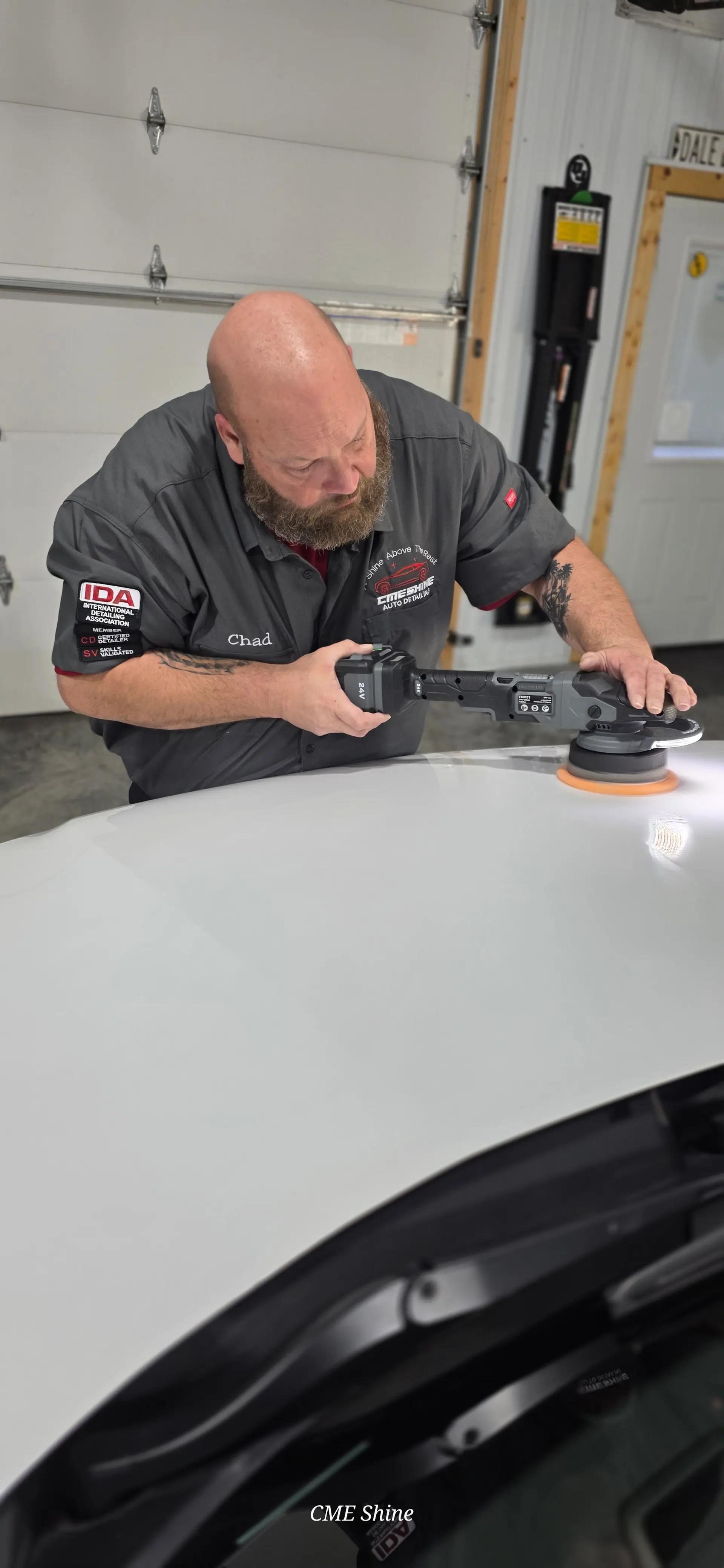 Fifty-fifty comparison of corrected and swirled paint under inspection lighting