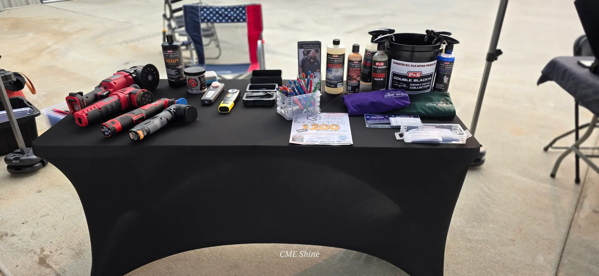 CME Shine banner at a community car event