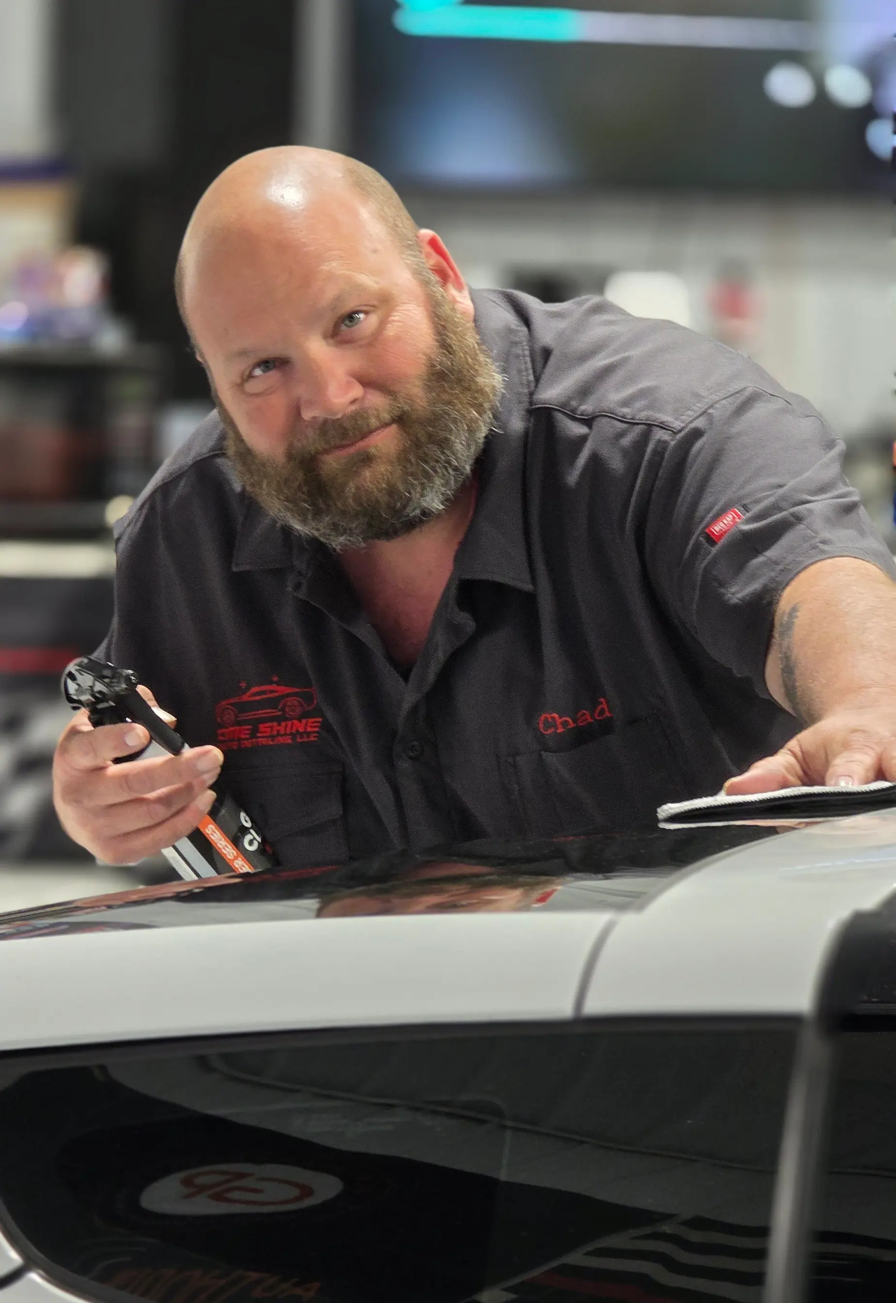 Chad Emerson detailing a vehicle at the CME Shine shop in Springville
