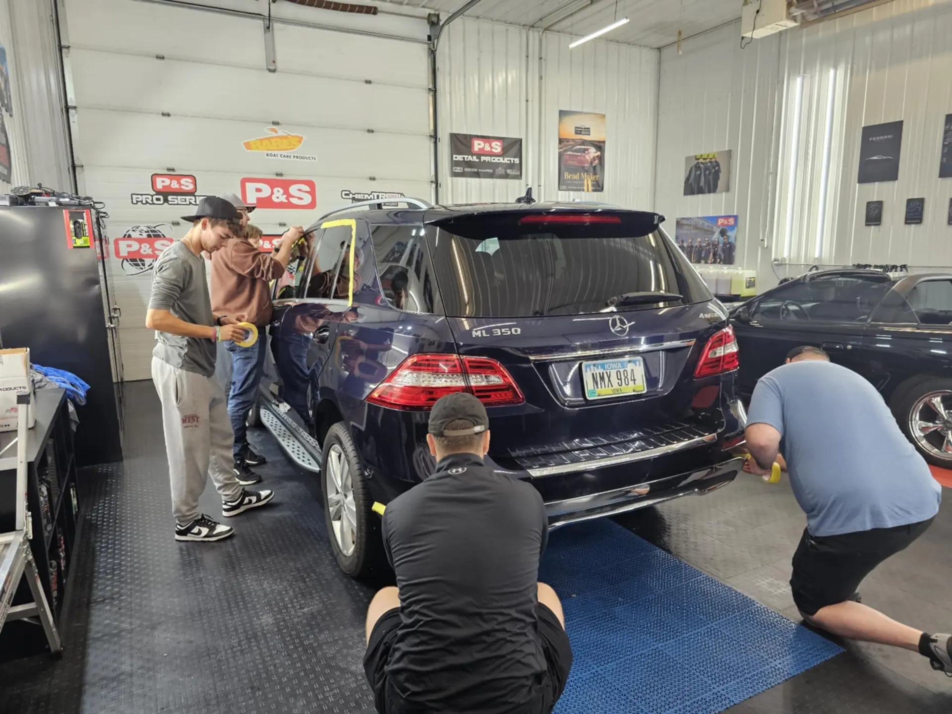 Wall of professional detailing certifications earned by CME Shine